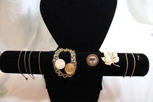 lot 492 image: 12K Gold Filled jewelry. Most marked 12K GF. Leaf pin marked  Taylord 12K Gold Filled, Chain earrings marked 12K GF, Eckerd RX pin marked 12K GF and has sapphire gemstone. Tested.