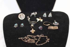 lot 493 image: Sterling Silver selection. Charms (including Turquoise), single earrings plus. Chain is 12K GF over Sterling. All marked 925 or sterling.