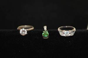 lot 495 image: Sterling Silver CZ trio. Solitaire ring Size 7.25, trillion ring 6.5. All 3 pieces marked 925 CZ.