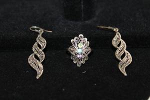 lot 496 image: Sterling Silver laser cut multi gemstone ring. Marked 925. Gems tested. Size 6 and a pair of Sterling laser cut dangle earrings. Marked 925. 2L