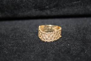 lot 446 image: 14K yellow gold ring with flexible mesh top. Marked 14K IG. (Imperial Gold). Size 7.5