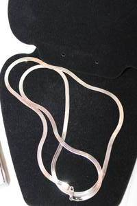 lot 459 image: Sterling Silver Serpentine necklace. Marked 925 Made In Italy Milor. Very long for Serpentine. 34L. Matches Lot 276 (New in package - had to break seal to measure)