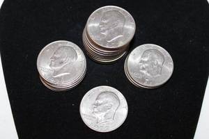 lot 210 image: Coins (22) 1971,2,4,7 Eisenhower Dollar Coins. Bid is times the quantity