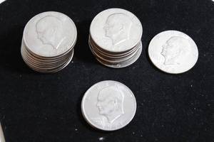 lot 213 image: Coins (21) 1971,2,4,8 Eisenhower Dollar Coins. Bid is times the quantity