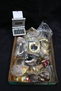 lot 138 image: Artisan crafted metal scarf holders, fold-up calculator, and Hand carved pieces from Kenya