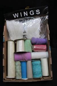 lot 143 image: Feather wings unopened, lace and mesh ribbons