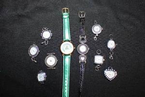 lot 148 image: Green leather band Christmas tree watch and watch faces