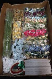 lot 505 image: Mini silk flowers in multiple colors and white lace ribbon
