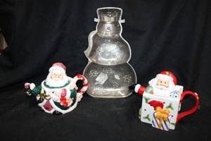 lot 109 image: Ceramic Santa teapots, and silverplated snowman tray