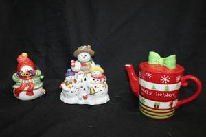 lot 110 image: Holiday housewares Ceramic holiday teapot, snowman candle holder, and Fitz and Floyd lidded sugar bowl
