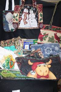 lot 112 image: Handmade purses in holiday and floral fabrics plus craft booklets