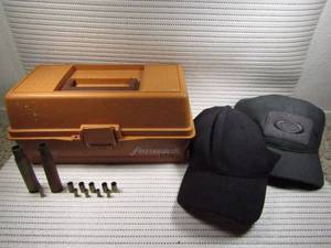lot 87 image: Fenwick fishing tackle box, 2 Oakley Caps, and 11 bullet casings with one live 22. Caliber bullet