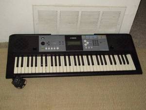 lot 89 image: YAMAHA electric keyboard