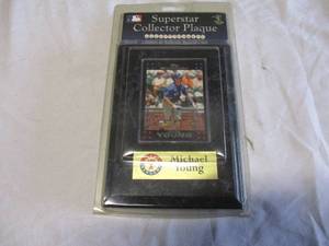 lot 60 image: Sports Images 5 x 7 Texas Rangers Michael Young Augraphed Baseball card On Wooden Plaque