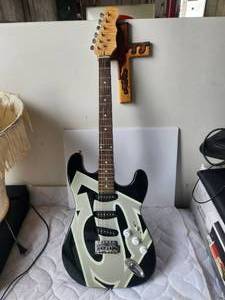 lot 133 image: Superman Guitar from Six Flags of Texas