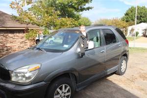 lot 1 image: Charlie Presents 2004 Buick Rendevous (Charlie NOT Included) NO TITLE Buyer will have to file for Bonded Title UPDATED  MILEAGE ADDED