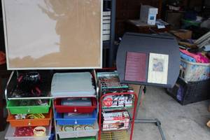 lot 61 image: Double Lot. one is a crafty lot with rolling drawers with misc. crafting items included and secondly a rolling wire bin with vintage VHS Tapes, including Several Abbott and Costello TV Show Volumes and Much More