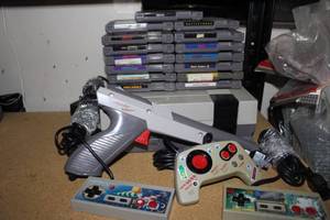lot 83 image: Ninteno NES system with Accessories and Games as shown in pictures