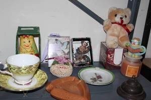 lot 108 image: Home Decor Items, China Cup and Saucer, Nesting dolls, Boyds Bear Lapel Pins, and much more