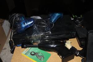 lot 119 image: PlayStation 2 Game Console and Controllers, Memory Card, Minicomputer Vaccuum
