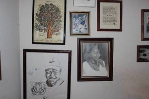 lot 71 image: Sketch Drawing of Tiger Woods and other artwork as pictured