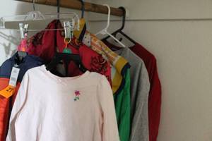 lot 135 image: Womens Plus size Holiday Shirts and 2 Kids outfits see photos