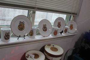 lot 137 image: Gibson Holiday Dishes in Decorative Boxes...4 sets of 4 plates and 2 sets of 4 cups