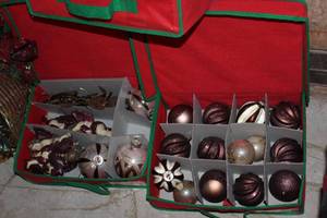 lot 393 image: Approx 7 ft Christmas Tree and Decorations, Tree Skirt, Stockings Ornaments, Gift Baskets, Santa and More, See Photos