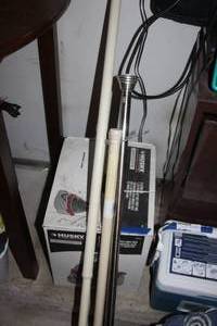 lot 174 image: Shop Vac, Appears Unused, and Tension Rods