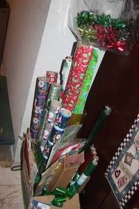lot 301 image: Box Full of Wrapping Paper, Gift Boxes, Gift Bags, Tissue Paper, Name Tags and Bows, Even Some Christmas Holiday Window Clings