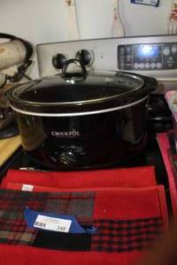 lot 348 image: Large Slightly Used Slow Cooker and Place Mats as Shown