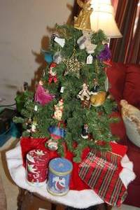 lot 319 image: Small Tree with Ornaments, Tree Skirt and Stocking