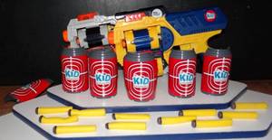 lot 35 image: 2 NERF STYLE GUNS WITH BULLETS & TIN CAN TARGETS