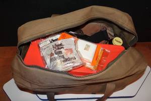 lot 37 image: VINTAGE MILITARY BAG FULL OF GUN CLEANING SUPPLIES AS ASHOWN