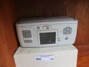 lot 24 image: Hp photo smart A616 printer and printer equipment
