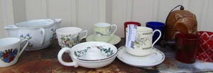 lot 28 image: Various votive candle holders, tea cups saucers and more