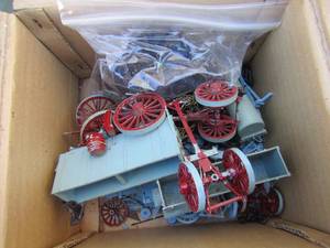 lot 80 image: Various small plastic horses and a carriage and wagon wheels, not put together unsure if all pieces are available, cool little lot