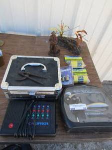 lot 86 image: misc. lot of table dcor, phone effects, cork screw kit, wooden statue, small black lock box not opened