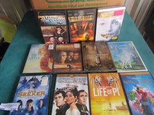 lot 124 image: Box full of DVDs all kinds, Christmas, kids, comedy, scary and more, check out the pictures for titles and names