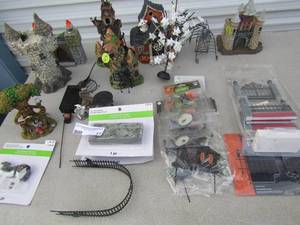 lot 17 image: Halloween lot of mostly new items such as, tiny treasures houses and dcor, woodland fairy tail, lighted gate  fence pieces and a spooky ghost tree and more