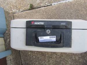 lot 168 image: Sentry safe with key, smaller size