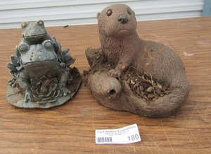 lot 180 image: Outdoor yard dcor- OTTER sitting on wood post holding a fish,  2 frogs one sitting on others back