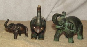 lot 15 image: PG 1992 black and greenish metal baby elephant 3 14 inch, green glass porcelain elephant 4 inch, apan metal small baby elephant 2 14