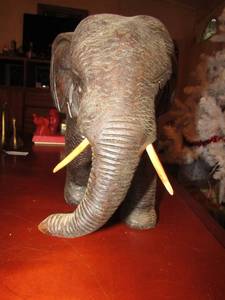 lot 19 image: Large dcor full size elephant with tusk in tack, 10 12 tall- 16 length