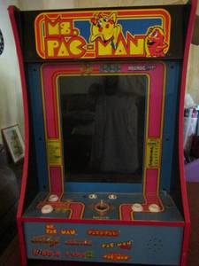 lot 36 image: Ms. Pac-Man arcade game in good condition but is missing cord 28 x 18 x 8