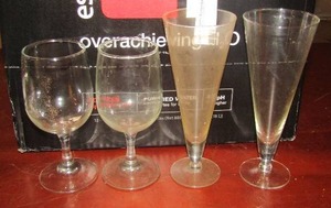 lot 39 image: Various wine glasses, clear glass skull canister, liquor canister