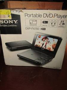 lot 56 image: Sony 7 dvd car player with screen, charger lost its in the original box