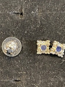 lot 76 image: 2 complete pair of earrings. 1 Safire and 1 diamond and 1 single earring Safire and diamond all pierced