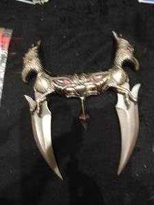 lot 206 image: Double blade fighting knife with pink stones 4 blades