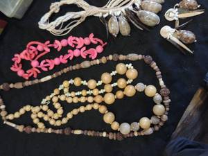 lot 65 image: 4  island inspired shell, wood, an seed pod necklace plus 1 exquisite artistic shell, hammered metal wood woven necklace and matching  clip earring set